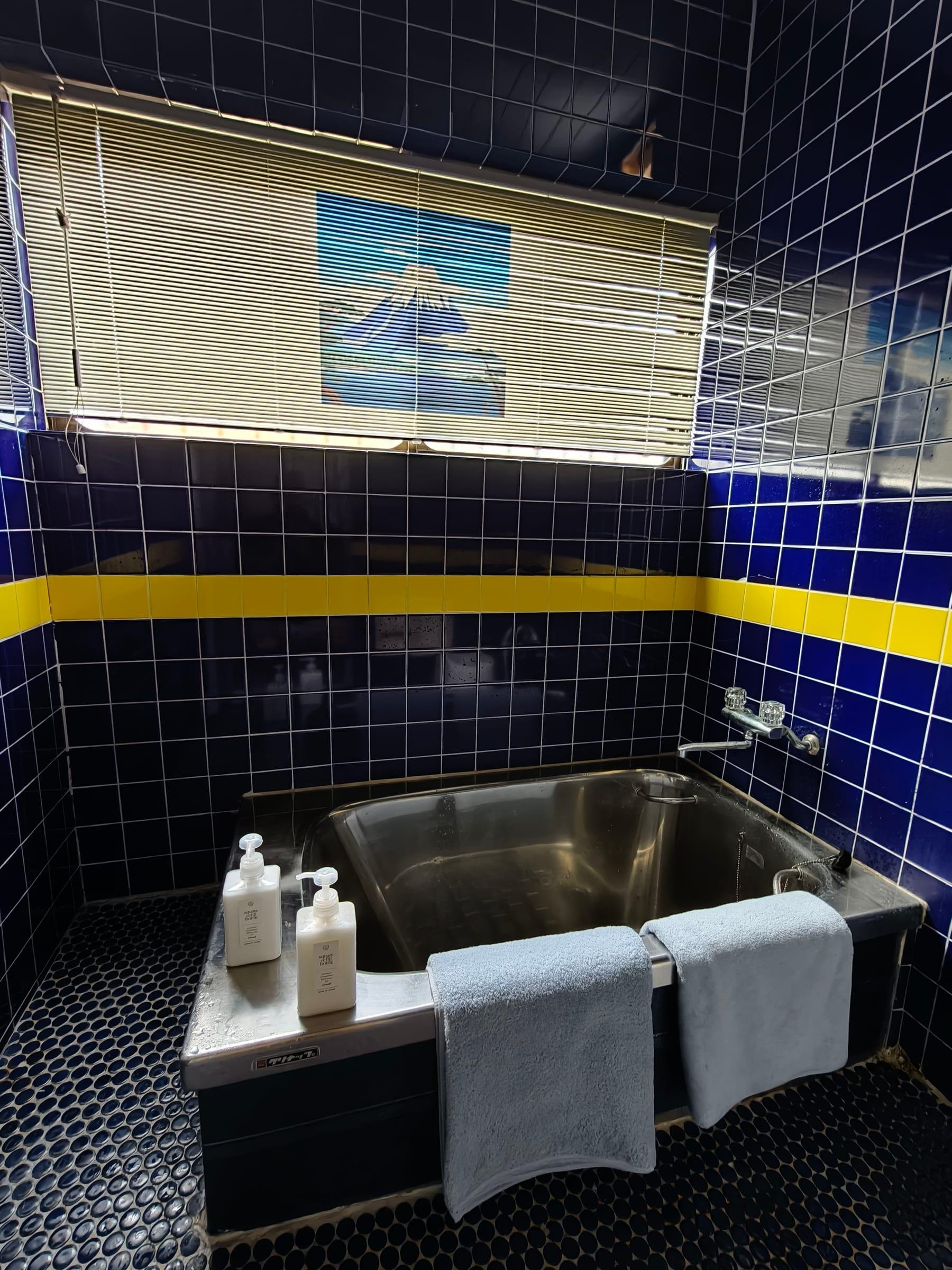 Blue-tiled bathroom at IKADA